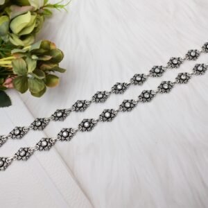 A full-length view of two 925 sterling silver anklets, showcasing continuous stone-studded floral link patterns alongside S-hook clasps on a soft white background.