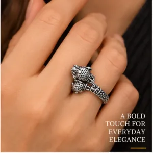 Close-up lifestyle portrait of a hand wearing the classic lion face chitai silver band, featuring text highlighting a bold touch for everyday elegance.