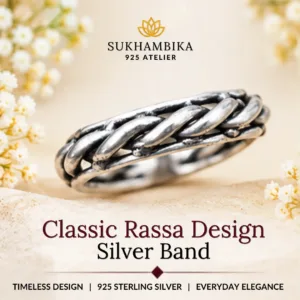 Promotional product image of classic rassa design silver band resting on a soft textured surface with white flowers, highlighting the 925 sterling silver purity and timeless design.