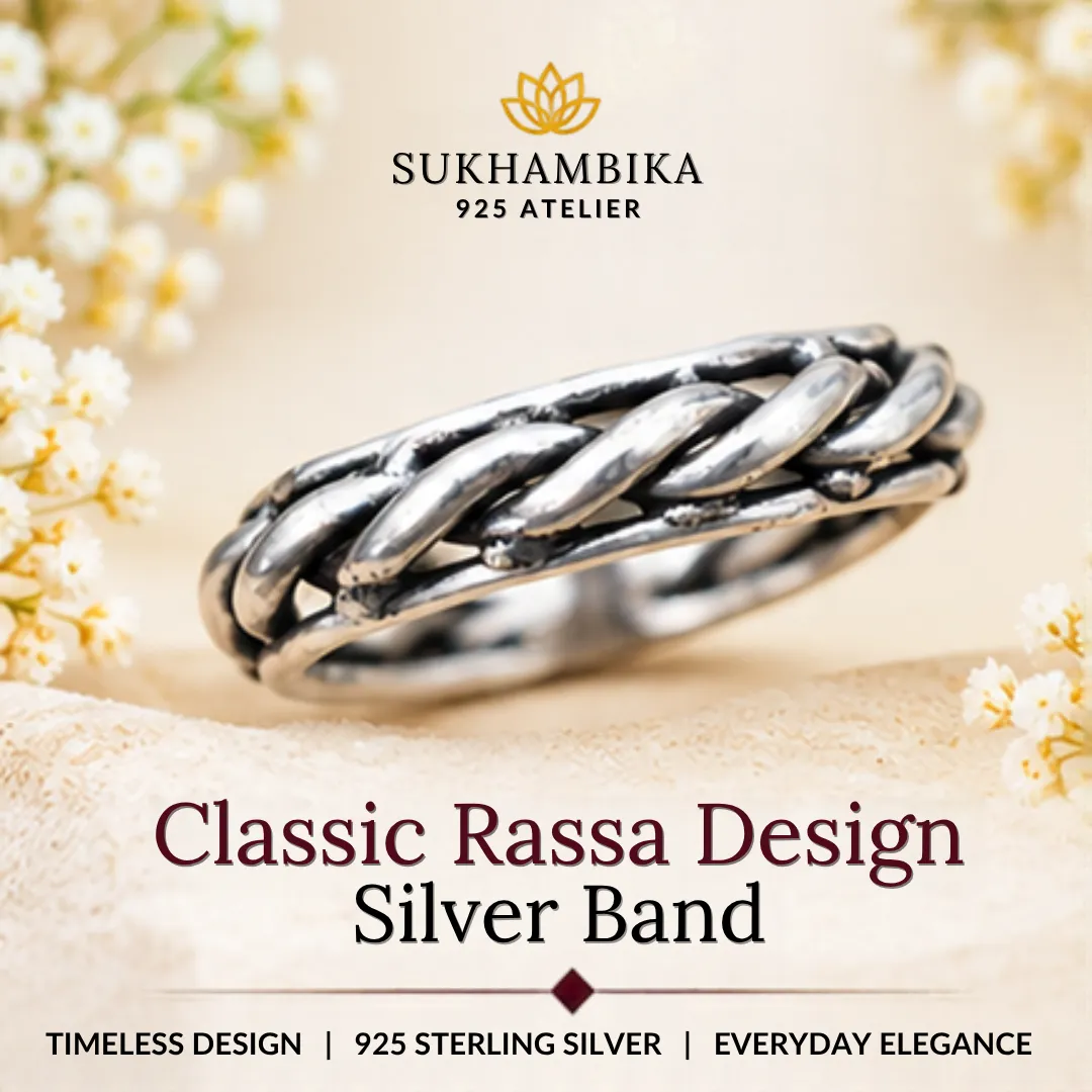 classic-rassa-design-silver-band Promotional product image of classic rassa design silver band resting on a soft textured surface with white flowers, highlighting the 925 sterling silver purity and timeless design.