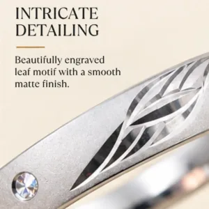 Detailed macro graphic of the impressive silver band highlighting the intricate detailing of the beautifully engraved leaf motif with a smooth matte finish.