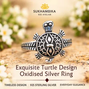 Promotional product image of an exquisite turtle design oxidized silver ring resting on a textured stone surface, highlighting the 925 sterling silver purity and timeless design.
