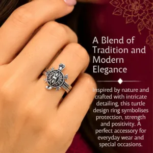 Close-up lifestyle portrait of a woman wearing the lucky tortoise design silver ring on her finger, featuring text that highlights a blend of tradition and modern elegance, symbolizing protection, strength, and positivity.