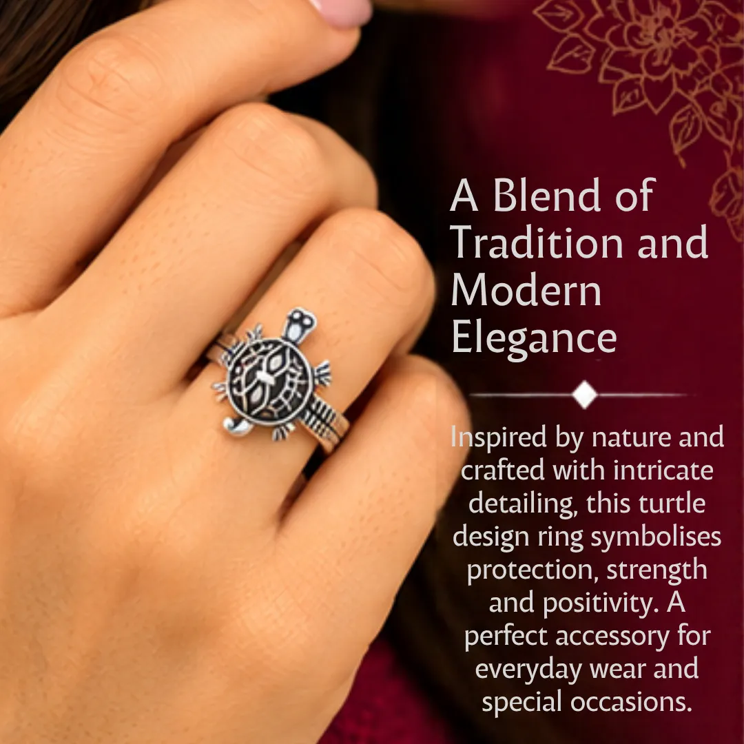 lucky-tortoise-design-silver-ring-product-details Close-up lifestyle portrait of a woman wearing the lucky tortoise design silver ring on her finger, featuring text that highlights a blend of tradition and modern elegance, symbolizing protection, strength, and positivity.