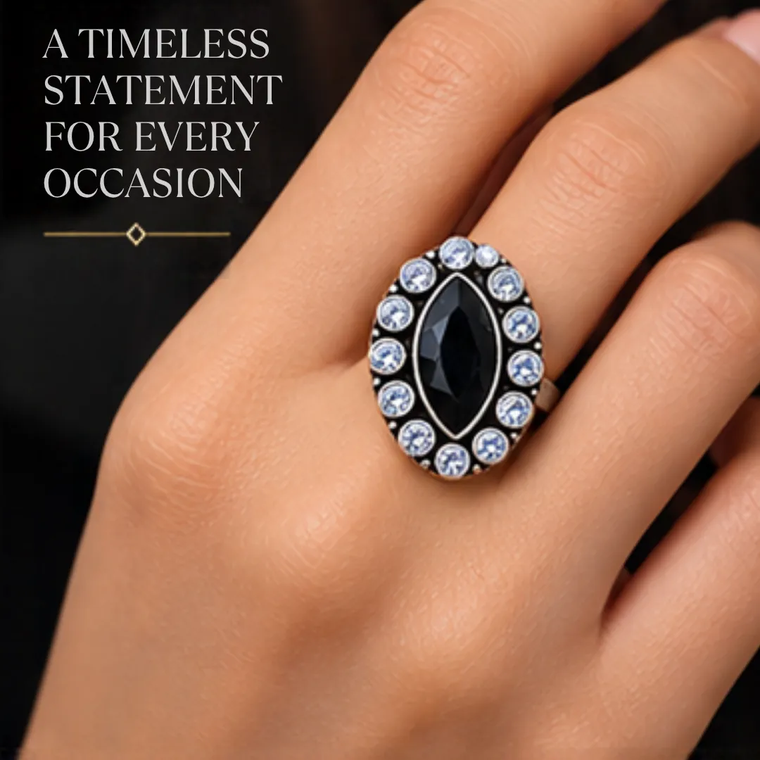 scintillating-center-black-cutstone-jadau-silver-ring-sukhambika (5) Close-up lifestyle portrait of a woman's hand wearing the scintillating center black cutstone jadau silver ring, featuring text highlighting a timeless statement for every occasion.