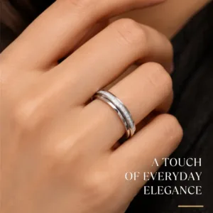 Close-up lifestyle portrait of a woman's hand wearing the scintillating cz stone finished silver band, featuring text highlighting a touch of everyday elegance.