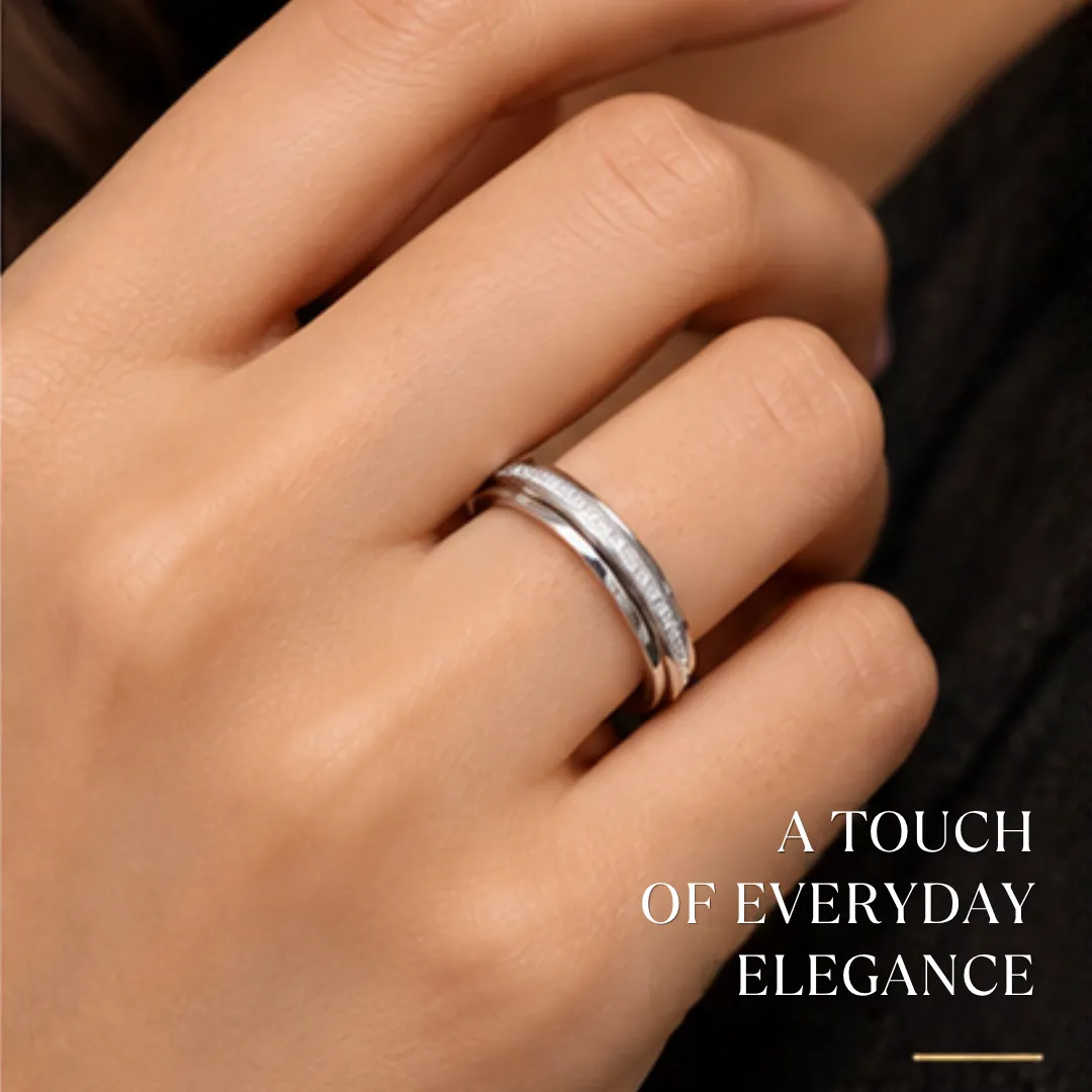 scintillating-cz-stone-finished-silver-band-sukhambika (2) Close-up lifestyle portrait of a woman's hand wearing the scintillating cz stone finished silver band, featuring text highlighting a touch of everyday elegance.