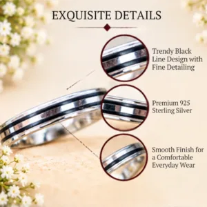 Detailed macro graphic of a silver band, highlighting the trendy black line design with fine detailing, premium 925 sterling silver construction, and a smooth finish for comfortable everyday wear.