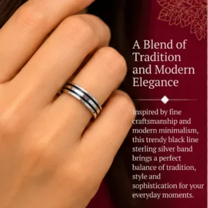 Close-up lifestyle portrait of a woman's hand wearing the trendy black line sterling silver band, featuring text that highlights a blend of tradition and modern elegance.