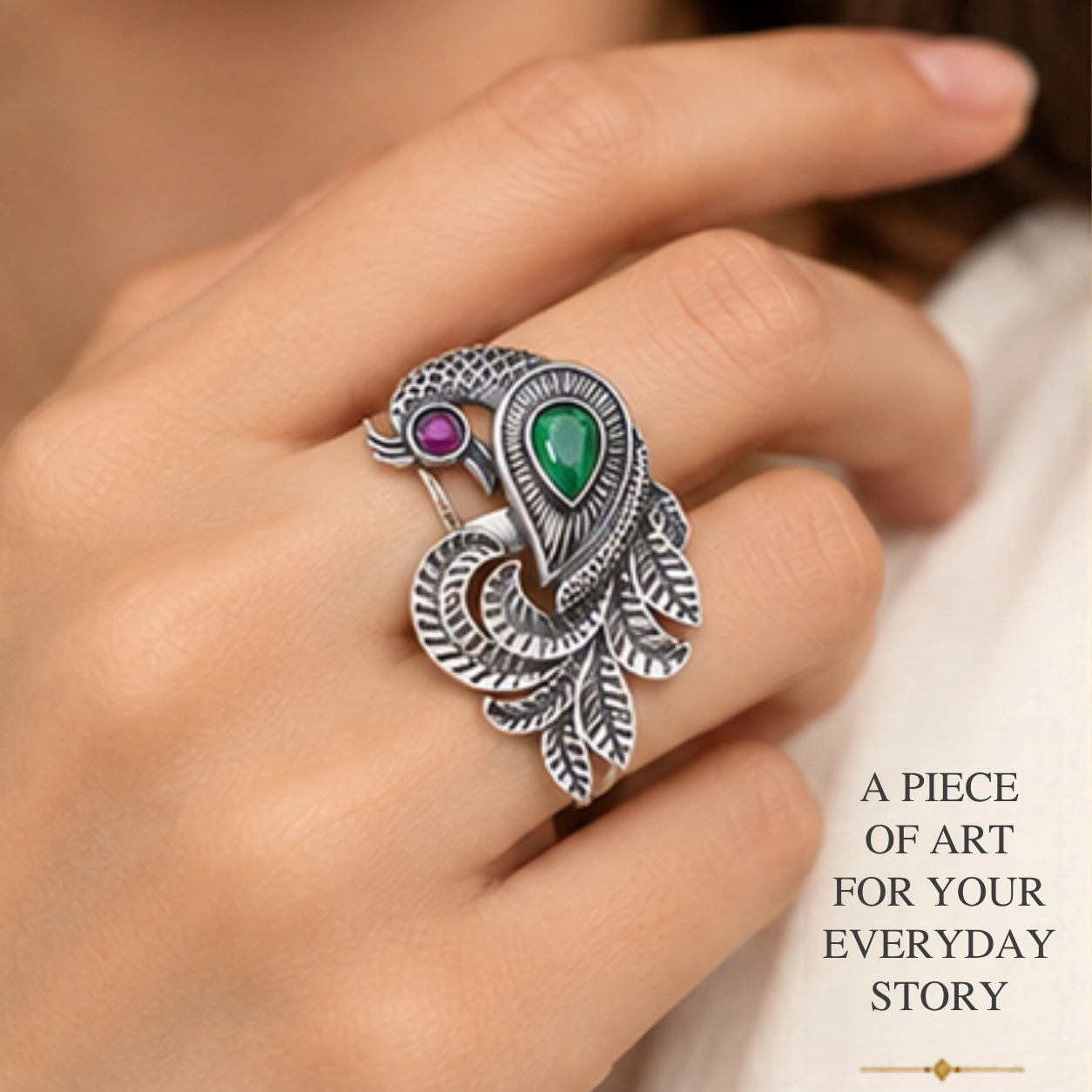 trendy-peacock-design-cutstone-silver-ring-sukhambika (2) Close-up lifestyle portrait of a woman's hand wearing the trendy peacock design cutstone silver ring, featuring text highlighting a piece of art for your everyday story.