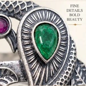 Detailed macro graphic of the peacock silver ring highlighting fine details and bold beauty, focusing on the green teardrop and magenta round cutstones.